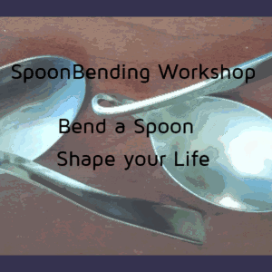 2 steel spoons twisted and bent on a tabletop